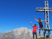 51 Alla croce di vetta di Cima Grem (2049 m) con vista in Arera